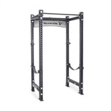 The Manticore Four Post Power Rack Builder by Bells of Steel is a gray steel power rack ideal for home gyms. It features reinforced corners, modular components with 1" holes for bar adjustments, and a top pull-up bar perfect for strength training exercises like squats and bench presses.