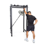 Product image of Manticore Four Post Power Rack  PREBUILT with a model holding a barbell