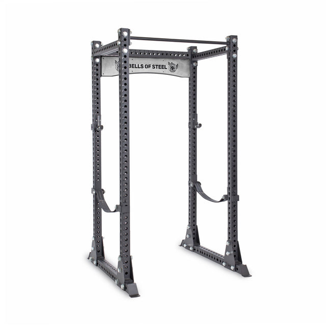 The Bells of Steel Manticore Flat Foot Power Rack - Prebuilt (3" x 3", 1" Holes) is a sturdy gray weightlifting rack with multiple adjustment holes and a top pull-up bar, perfect for any home gym setup.