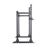 The Manticore Half Rack Builder by Bells of Steel is a black metal, open-frame power system for weightlifting with a modular design. It features 3" x 3" posts and 1" holes for adjustable attachments, displayed against a white background, offering versatile workout possibilities.