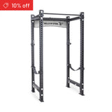 The Manticore Four Post Power Rack Builder (3" x 3", 1" Holes) by Bells of Steel is a gray steel rack with adjustable attachment holes. A red "10% off" banner appears in the top left, showcased on a plain white background.
