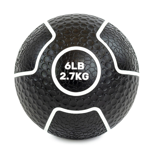 The black Mighty Grip Medicine Ball by Bells of Steel features a superior grip with its textured surface and white lines, prominently marked "6LB 2.7KG" in bold white text, making it versatile for all fitness levels—a perfect addition to your collection.