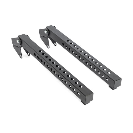Two black metal Bells of Steel Lever Arms Rack Attachments with multiple holes and locking mechanisms, placed parallel on a white background—space-saving additions ideal for your adjustable pull-up bar setup.