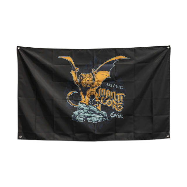 A black Bells of Steel home gym flag features a yellow, winged manticore standing on a rock. "Manticore Series" is elegantly scripted, with "B&S 2023" in the top right corner, making it an ideal decor piece for your gym.