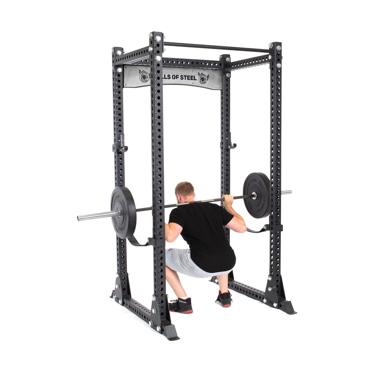 product picture of Manticore Flat Foot Power Rack PREBUILT with male model performing squats