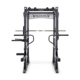 The Manticore Flat Foot Power Rack Builder from Bells of Steel, with a 1,000 lb capacity, features multiple attachments like pull-up and dip bars and weight pegs. This black rack is branded at the top and perfect for strength training exercises.