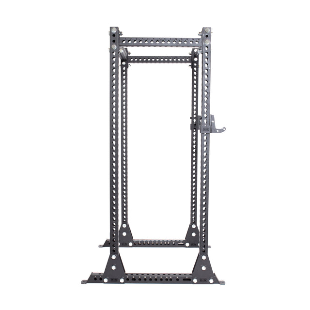 The Manticore Flat Foot Power Rack by Bells of Steel, with a 1,000-pound capacity, features numerous 1" bolt holes on its 3" x 3" uprights for barbell height adjustments and a horizontal top bar with sturdy triangular base supports—ideal for squats and bench presses.