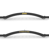 The Bells of Steel Omni Bar features two sleek black curved bars with bold yellow text, "OMNI" and "IN STRENGTH WE TRUST." Ideal for power racks, their premium knurling stands out against a white backdrop, showcasing the high-quality design typical of Omni Bar gym equipment.