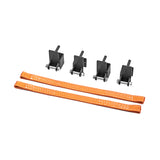 Four black metal brackets with bolts and two orange Bells of Steel Safety Straps for 2.3" x 2.3" racks are laid out on a white background—ideal for adding barbell protection to your power rack.