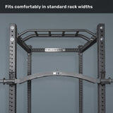 A pull-up bar attachment mounted on a black Bells of Steel power rack against a gray wall, with "Fits comfortably in standard rack widths" at the top—ideal with cable attachments or specialty bars like the Arch Nemesis Swiss Bar.
