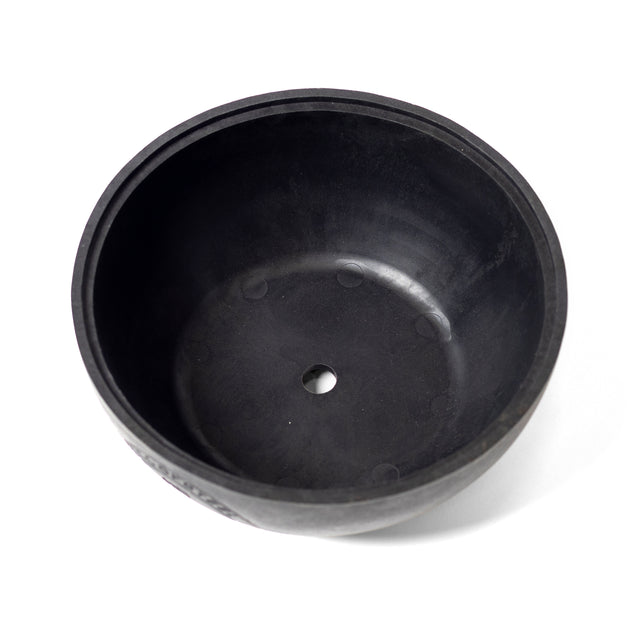 The Plastic Bottom for Adjustable Kettlebell by Bells of Steel is a black, round rubber bowl with a smooth surface and central hole, perfect for single-arm exercises. It is displayed against a plain white background.