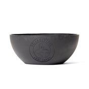 The Plastic Bottom for Adjustable Kettlebell by Bells of Steel is a black, round bowl with a matte finish featuring an embossed logo of a muscular figure and "BELLS OF STEEL EST. 2010." It's designed for single-arm exercises and stands out simply against a plain white background.