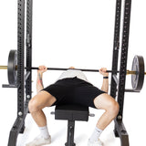male athlete using the Pin Pipe Safeties for barbell bench press