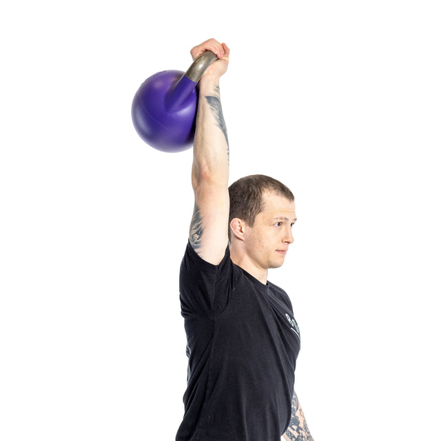 A person wearing a black t-shirt holds a Bells of Steel Adjustable Competition Kettlebell overhead with one hand. Facing left, they showcase tattoos on their arm against a white background, perfectly highlighting the intensity of their kettlebell training session.