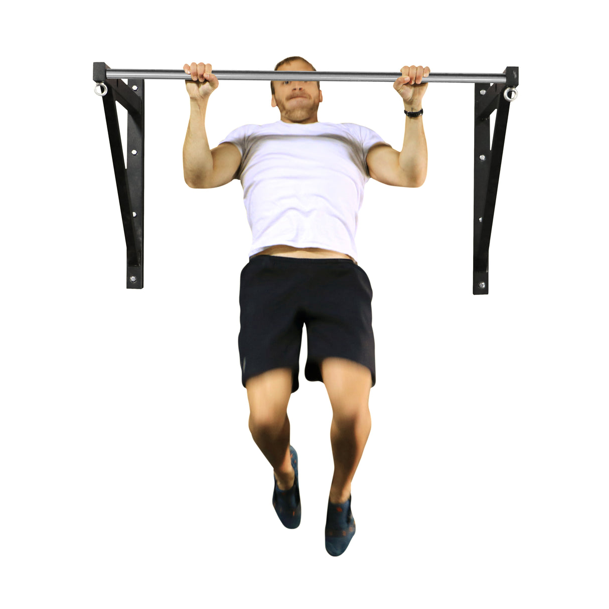 A person in a white T-shirt and black shorts does a pull-up on the Bells of Steel Adjustable Wall Or Ceiling Mounted Pull Up Bar against a white background, with slightly bent legs and focused expression.