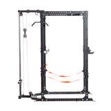 The Bells of Steel Residential Power Rack (2.3" x 2.3", ⅝" holes) is a black metal gym rack with cable pulley system, pull-up bar, orange safety straps, J-cups, and numbered holes for attachments—ideal for any home gym. Set on a white background.