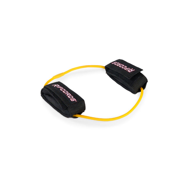A yellow Human Trainer - Leg Cords resistance band by Bells of Steel USA, featuring black padded ankle straps and arranged in a loop on a white background.