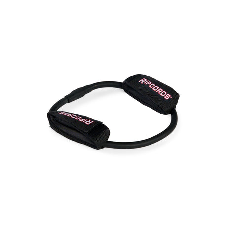 A black Human Trainer - Leg Cords resistance band by Bells of Steel USA, featuring two black fabric handles labeled “RIPCORDS” in red and white text, designed for progressive tension leg exercises, arranged in a circular shape on a white background.