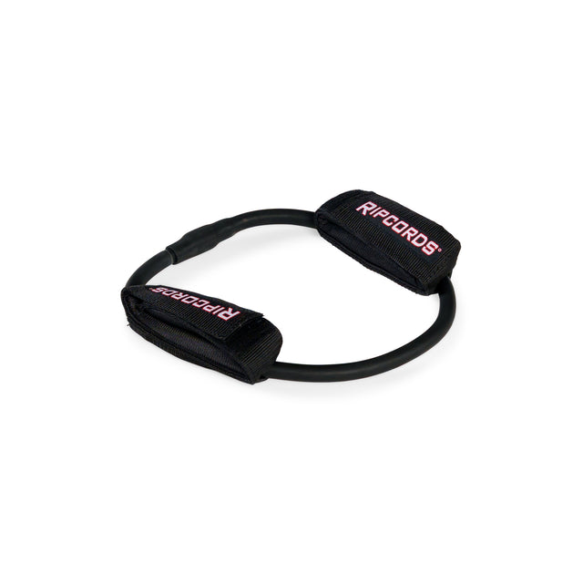 A black Human Trainer - Leg Cords resistance band by Bells of Steel USA, featuring two black fabric handles labeled “RIPCORDS” in red and white text, designed for progressive tension leg exercises, arranged in a circular shape on a white background.