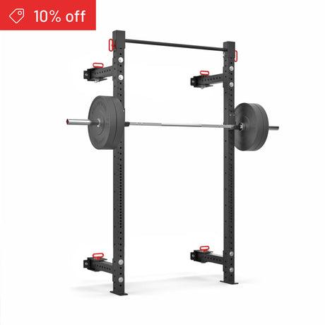The Bells of Steel Roc Foldable 2 Post Cage Builder (3"x3", ⅝" holes) in black is shown with a loaded barbell and red adjustment handles on a white background. A red "10% off" label appears in the top left, perfect for your home gym.