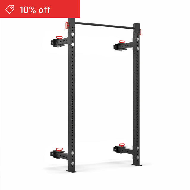 The Bells of Steel Roc Foldable 2 Post Cage Builder (3" x 3", ⅝" holes) squat rack features a black metal build with red accents and multiple adjustment holes. A red “10% off” banner appears in the top left over a white background. Ideal for home gyms.