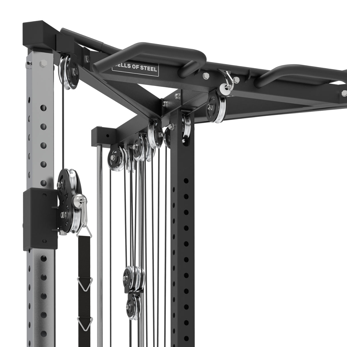 A close-up of the Bells of Steel All-in-One Trainer in a home gym highlights its multiple cables and pulleys. Crafted with metal and black plastic, it’s designed for diverse strength exercises, showcasing the versatility of a functional trainer.