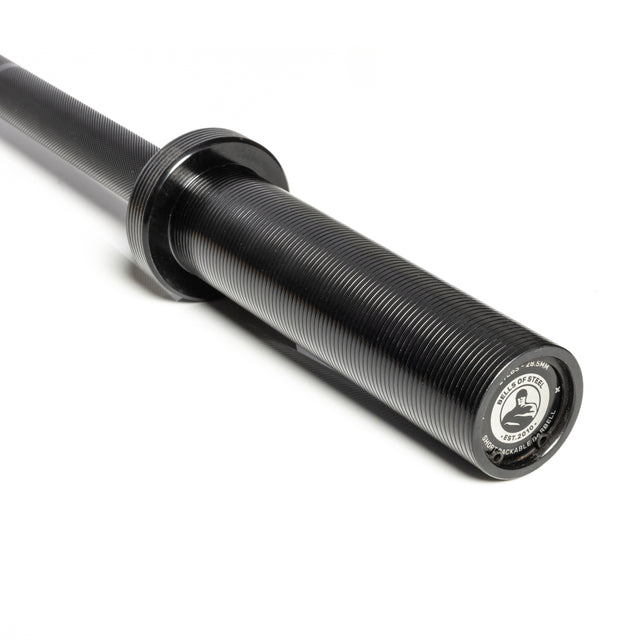 A close-up of the black, grooved sleeve and end cap of a Bells of Steel Short Utility Barbell on a white background. The end cap displays branding and specs in black and silver, making it ideal for any home gym setup.