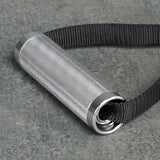 The Bells of Steel USA Aluminum Handles Pair with Bearings, featuring a knurled grip and black woven strap, rests on a gray stone surface.