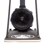 Close-up of the Bells of Steel Blitz Ski Trainer's black fan and flywheel on a textured base with a white circular logo, emphasizing the front design made for intense full-body workouts.