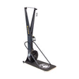 The Bells of Steel Blitz Ski Trainer is a black machine with a fan flywheel, monitor, and dual handles on a platform with a white logo—ideal for full-body workouts or simulating cross-country skiing indoors.