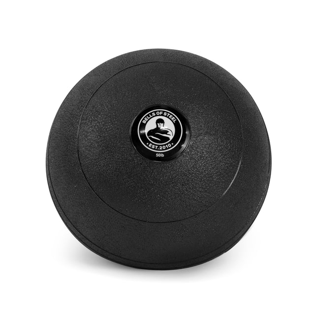 The black Bells of Steel slam ball, ideal for cardio and explosive power workouts, features a textured surface with the "Bells of Steel Est. 2010" logo above "50 lb" on a white background.