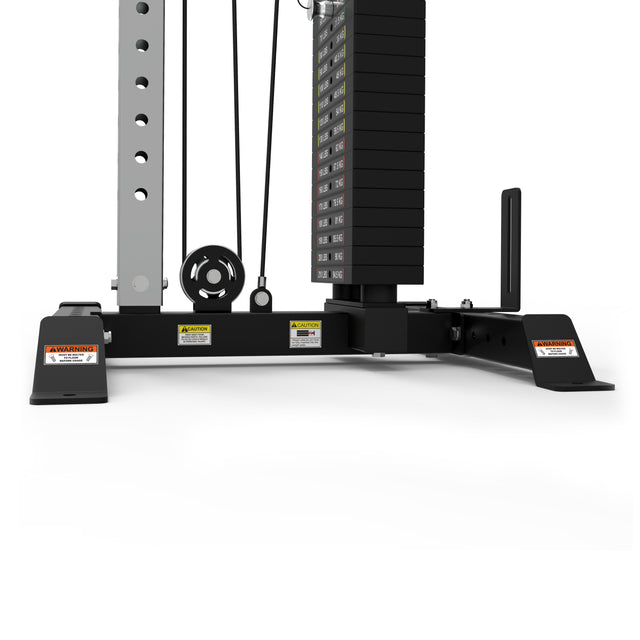 A close-up of the Cable Tower by Bells of Steel shows the weight stack with pulleys on a black tower. The base has warning labels, and adjustable handles make this gym equipment ideal for strength training exercises.