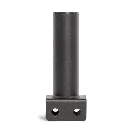 The Bells of Steel Hydra Vertical Bar Holder for Flat Foot, a sleek black metal cylindrical pipe, stands upright on a flat base with two circular holes, contrasting boldly against a plain white background.