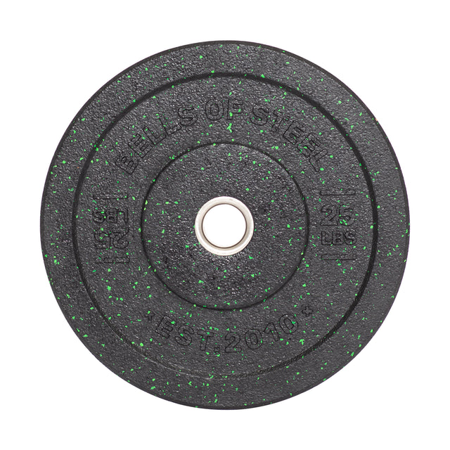 The Bells of Steel Crumb Bumper Plate, designed in black with green flecks, weighs 25 pounds (11.34 kg) and features a central metal hub for easy barbell use. Established in 2010, it's perfect to enhance your lifting routine.