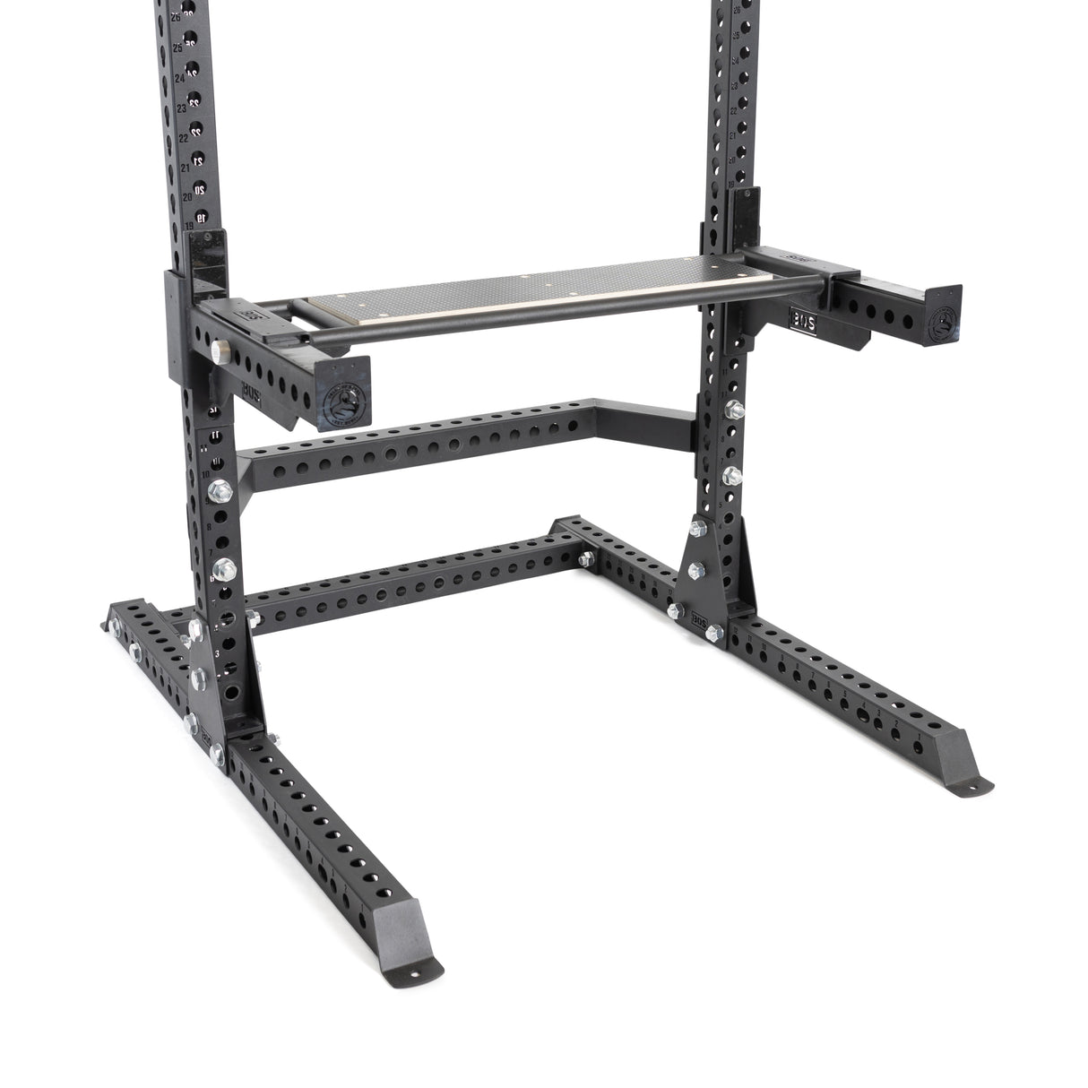 The Bells of Steel Utility Seat for Hydra/Manticore features a sturdy black metal squat rack with a pull-up bar attachment on a plain white background. Its versatile structure includes multiple adjustable holes, making it perfect for use with a weight bench.