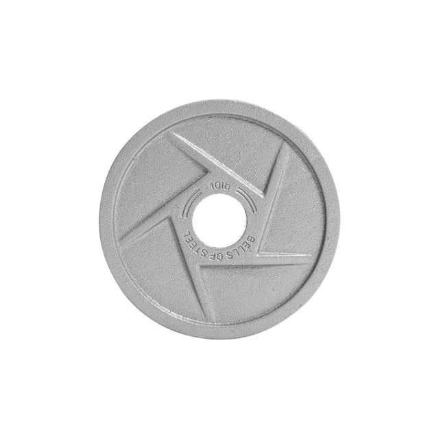 The gray Mighty Grip Olympic Weight Plate by Bells of Steel is round with "Bells of Steel" engraved, featuring precision grip handles and a center hole. Its ergonomic design includes angular lines and a striking geometric pattern.