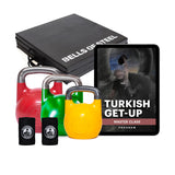 The Wildman Turkish Get Up Kettlebell Bundle by Bells of Steel USA includes three vibrant ProGrade kettlebells in red, green, and yellow, black wrist wraps, a foldable exercise mat, and a tablet showing the "Turkish Get-Up Master Class Program" cover—ideal for fitness enthusiasts.