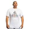 A man wears the Bells of Steel Bamboo T-Shirt, featuring a colorful triangle graphic and "HYDRA SERIES BELLS OF STEEL INC." text, while standing against a white background and looking slightly to the side with a neutral expression.