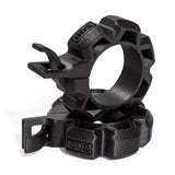 Two black, rugged Barbell Zip Clips - Half Standard (Pair) from Bells of Steel, circular with ridged edges and integrated clips, are stacked together on a white background, resembling standard barbell clips.