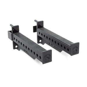 The Bells of Steel Spotter Arms Rack Attachment features black metal arms with a logo on the end cap, adjustable holes with UHMW lining, ideal for barbell supersets. They are displayed at an angle against a white background.