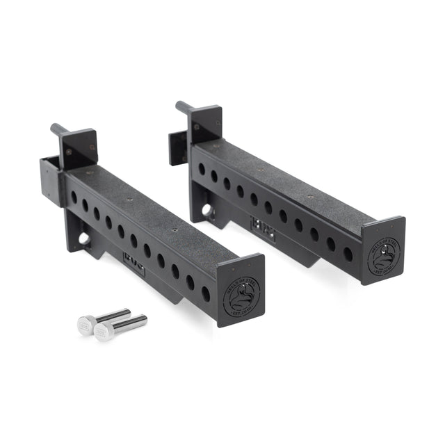 Two Bells of Steel Spotter Arms Rack Attachments, made from heavy-duty black metal with adjustable holes and a cylindrical design, are paired with two silver locking pins on a white surface.