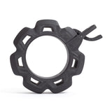 A front view of the Bells of Steel Barbell Zip Clips - Half Standard (Pair) shows a black, gear-shaped plastic ring with six outward notches and a hook, designed as a pressure-cuff, set against a white background.