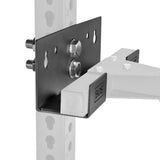 Close-up of the Bells of Steel Wall or Rack Mounted Bench Hanger attached to a vertical post with bolts. Featuring multiple holes for adjustable mounting, it supports a white "BOS" arm. Background is plain and uncluttered.