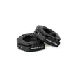 Two black, hexagonal Magnetic Clamp Collars from Bells of Steel are displayed on a white background, with one collar resting slightly atop the other.