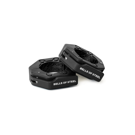 Two black, hexagonal Magnetic Clamp Collars from Bells of Steel are displayed on a white background, with one collar resting slightly atop the other.
