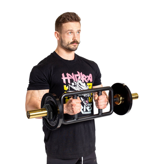A man with a mustache in a black graphic t-shirt holds a barbell with weights and Bells of Steel Magnetic Clamp Collars on each end, standing against a white background.
