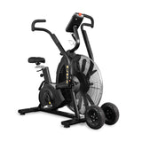 The Bells of Steel Blitz Max Air Bike is a black air bike with dual handlebars, large front fan, adjustable seat, digital display, and two rugged wheels—ideal commercial cardio equipment for intense workouts.
