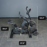 Side view of a black Bells of Steel Blitz Max Air Bike, showing labeled dimensions: 30.2" seat height, 53.4" handlebar height, and 57.2" length. The commercial fitness bike is on a gray tiled floor against a gray wall.