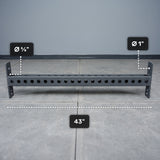 The Bells of Steel USA Crossmember For Converter Bench - 43" is displayed on a tiled floor, featuring evenly spaced holes with diameters of 5/8 inch and 1 inch along its 43-inch length.