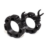 A pair of Bells of Steel Barbell Zip Clips - Half Standard, featuring a black 3D-printed gear-like design with locking levers, displayed on a white background.
